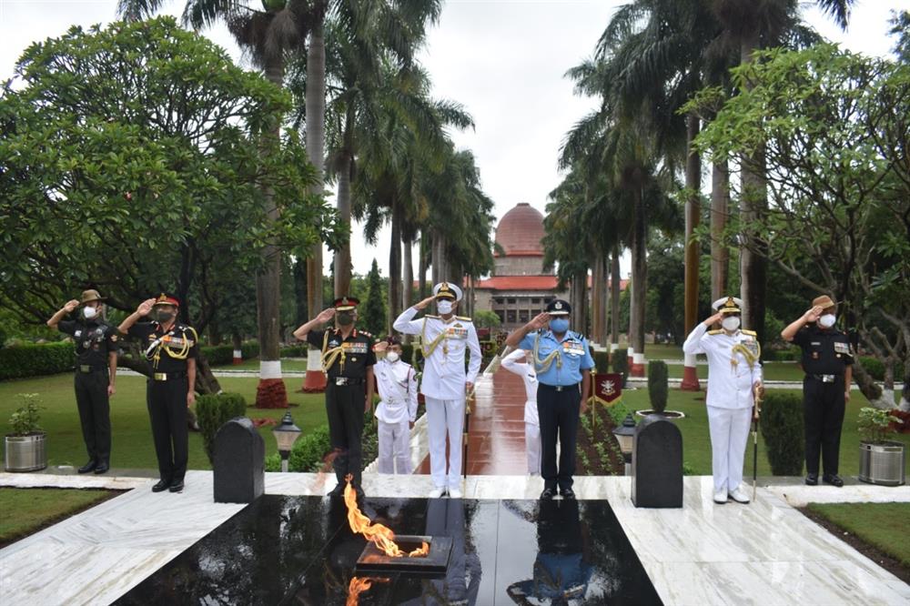 Description: C:\Users\dell optiplex\Downloads\Three Service Chiefs saluting the martyrs of National Defence Academy at Hut of Remembrance in presence of Commandant & Deputy Commandant.JPG