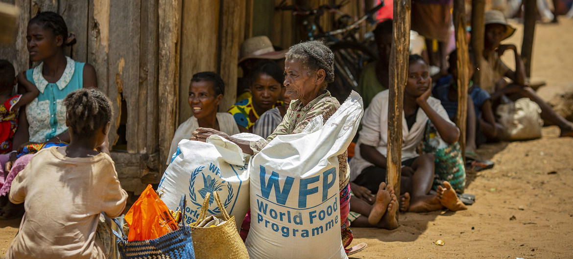 Residents in the drought affected communities of Ifotaka, southern Madagascar, collect food assistance provided by the UN World Food Progamme.
