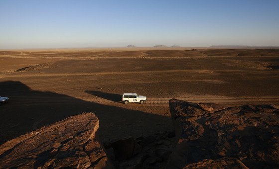 A UN patrol team, deployed for monitoring ceasefire, drives through the Smara area of Western Sahara.