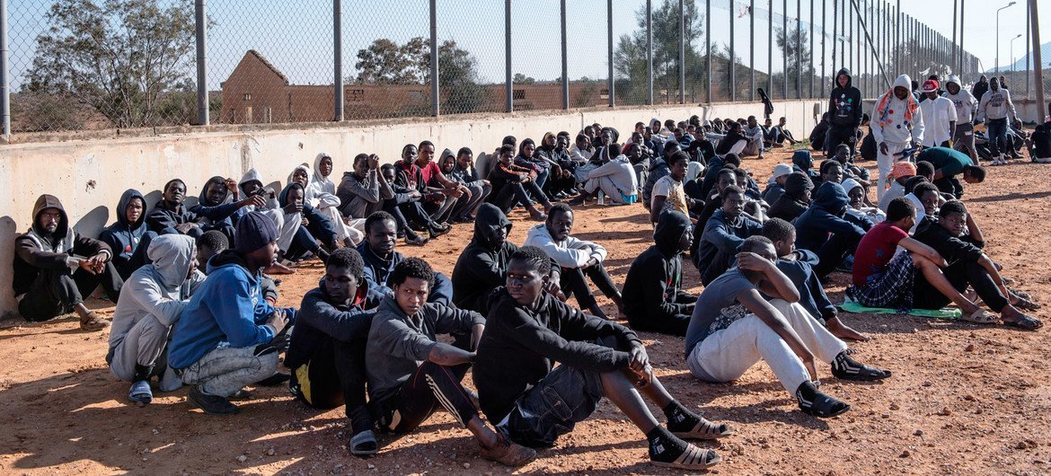 Migrants sit in the courtyard of a detention centre in Libya. (file)