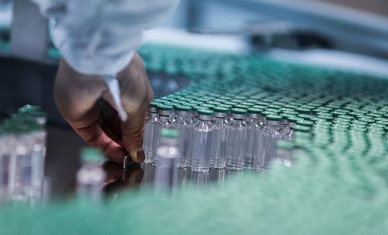 An employee works on the production line of a COVID-19 vaccine in India