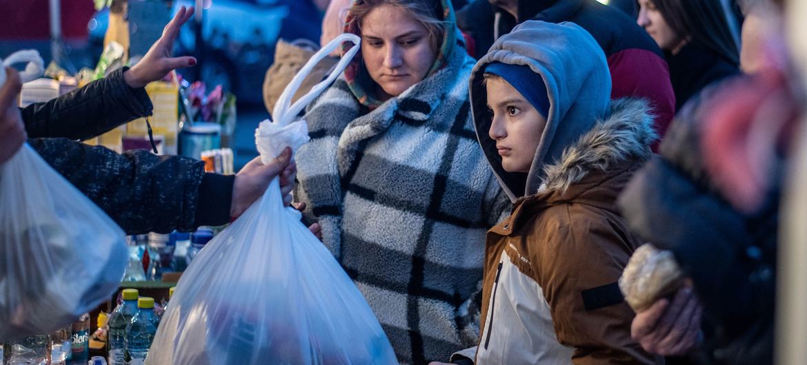 On 5 March 2022, children and families reach Berdyszcze, Poland, after crossing the border from Ukraine, fleeing escalating conflict.