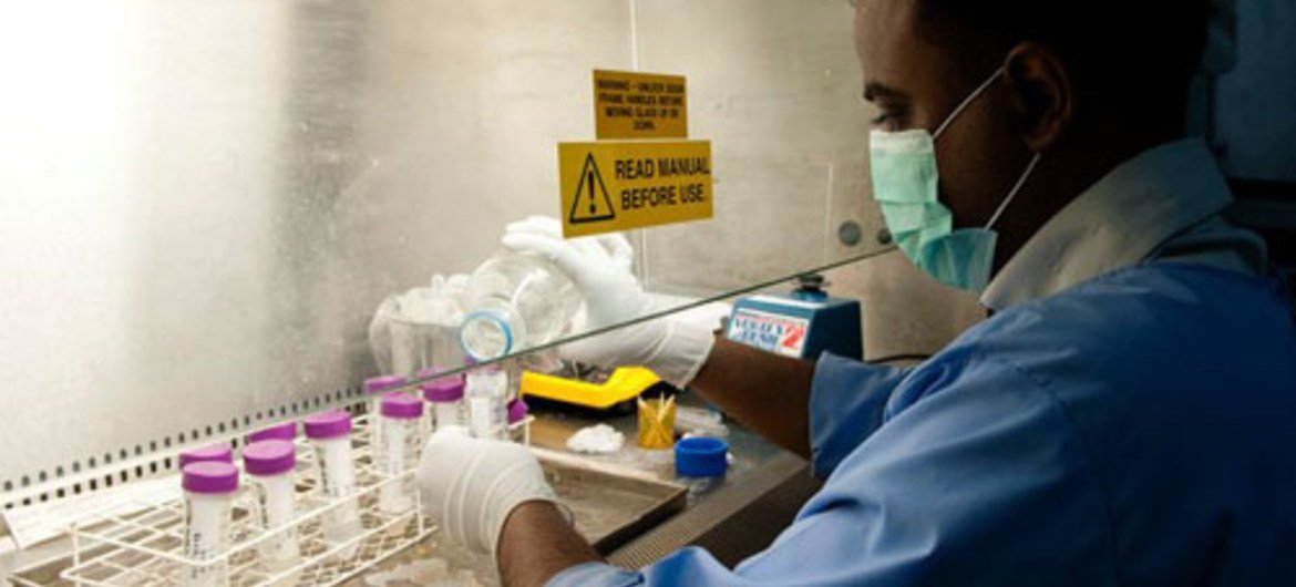 A laboratory technician in Bangladesh manipulates multi drug resistance tuberculosis (MDRT) samples. Photo: The Global Fund/Thierry Falise