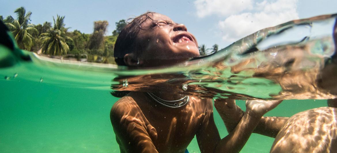 Moken children swim in the Myeik Archipelago in Myanmar.