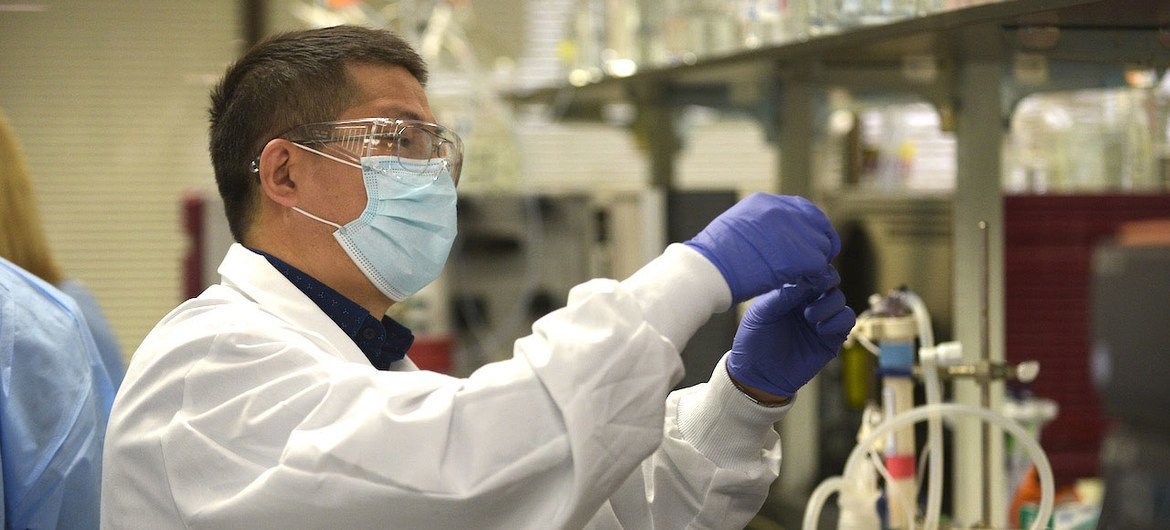 A laboratory scientist works on the Novavax COVID-19 vaccine.