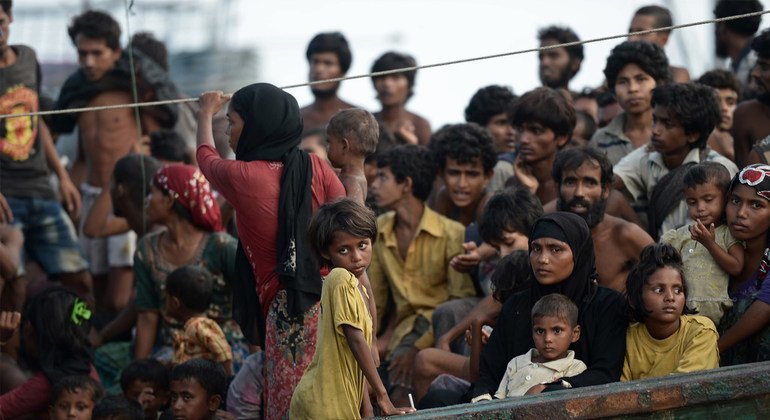 Stranded Rohingya people sit on the deck of an abandoned smugglers’ boat drifting in the Andaman Sea in 2015.