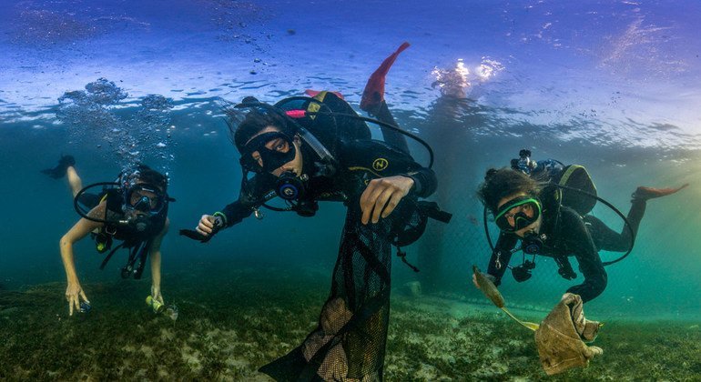 Underwater photographers have been drawing attention to the dangers of plastic pollution in oceans across the world as part of completion to highlight World Oceans Day.